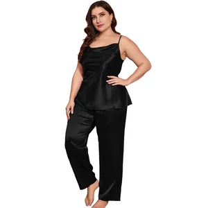 Plus size black satin two-piece pajama set with spaghetti strap top and straight-leg pants