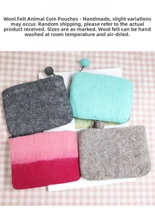 Detailed view of handmade wool felt animal coin purses with zipper and pom-pom charms