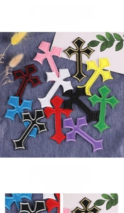 Detailed view of colorful cross embroidery patches for clothing and accessories