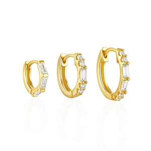 Three gold-plated sterling silver hoop earrings with clear zircon stones on a white base