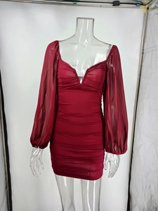 Detail view of wine red V-neck dress featuring mesh sleeves and gathered waist design