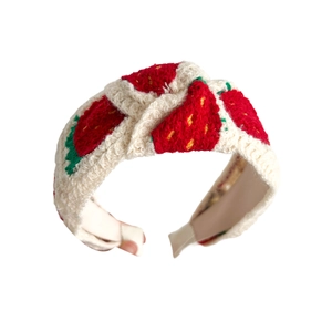 Knitted strawberry embroidery headband with high top knot style on white background