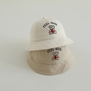 Cream and khaki kids fisherman hats with teddy bear embroidery and Feel Good text
