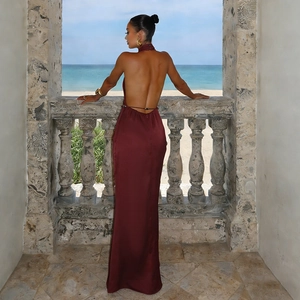 Elegant backless burgundy satin halter gown featuring a deep open back and a long silhouette