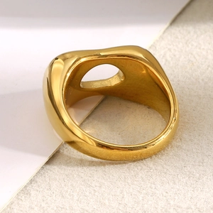 Macro shot of minimalist 18K gold plated thick ring with circular hollow center