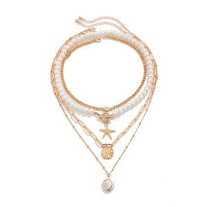 Bohemian multi-layer gold necklace with white pearls, starfish, and seashell pendants
