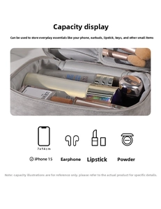 Macro view of gray fabric makeup bag interior with brushes and large storage capacity