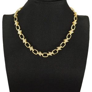 Gold lightning bolt and oval link cuban necklace with pavé diamonds on model
