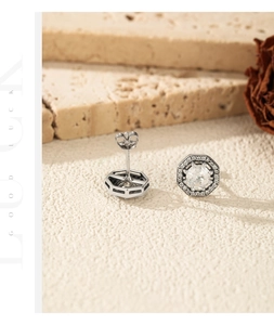 Detail shot of silver S925 octagonal stud earrings with halo-set clear cubic zirconia