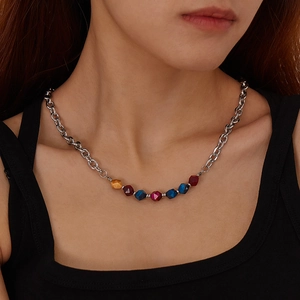 Detail of silver stainless steel chain necklace with colorful faceted natural stone beads