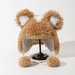 Brown plush bear ear trapper hat with white faux fur lining and large pom-poms