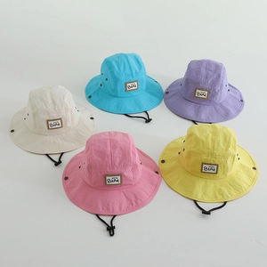 Close-up of quick-dry kids bucket hats in five colors with adjustable windproof ropes