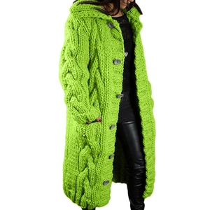Close-up of chunky knit pattern and grey buttons on this long green hooded cardigan