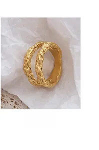 Detailed view of wide 18K gold plated ring featuring a hammered lava texture finish