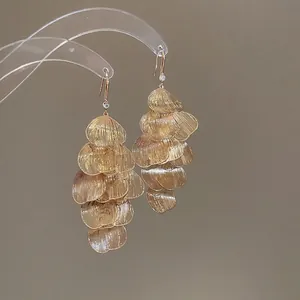 Elegant gold layered petal tassel earrings with textured leaves and zircon stud