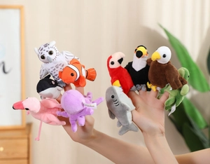 Detailed view of ten plush sea and bird finger puppets worn on hands for early education