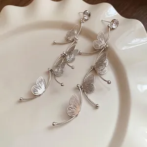 Silver butterfly drop earrings with sparkling rhinestones and delicate layered fringe