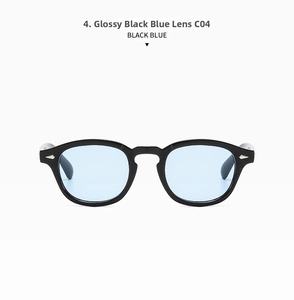 Detail of round retro sunglasses with black frame, blue lenses and metal diamond rivets