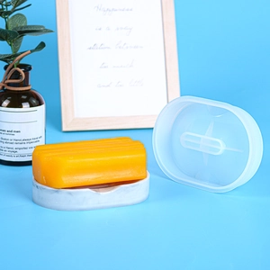 Translucent oval silicone soap mold for DIY resin soap dishes shown in a lifestyle setting