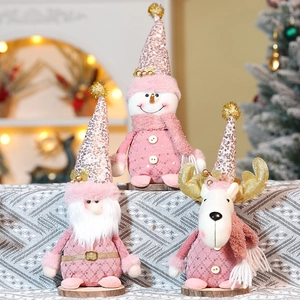 Plush pink Christmas dolls featuring Reindeer Snowman and Santa with gold sequins
