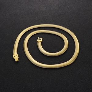 Mens 8mm golden stainless steel flat snake bone chain necklace on black background