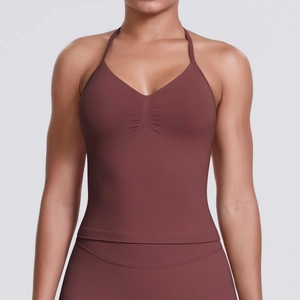 Detail of seamless yoga halter top featuring ruched chest design and ribbed knit fabric