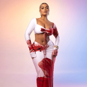 Detail of red floral two-piece set featuring drawstring ruched top and matching maxi skirt