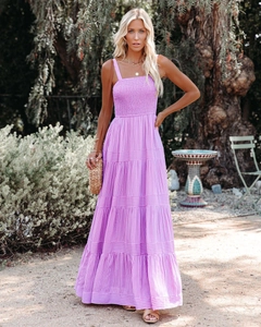 Detail of lavender purple smocked bodice and tiered floral long dress for summer beach vacations