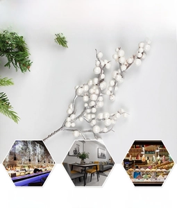Close-up of glittery white artificial berry stems for festive floral arrangements