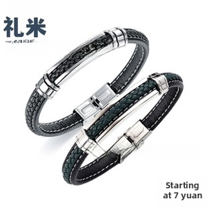 Detail of woven leather bracelets in black and dark green with stainless steel clasps