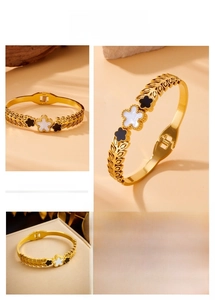 Detailed views of gold-plated bangle with black and white floral and wheat patterns