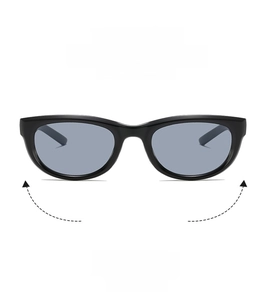 Detail of vintage cat-eye sunglasses with thick black frames and blue tinted lenses