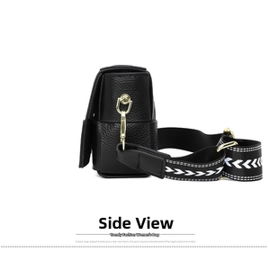 Detailed side view of black pebble grain leather bag with wide arrow pattern woven strap