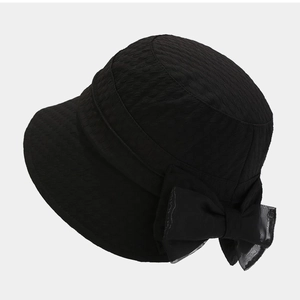 Chic black foldable sun bucket hat for women with elegant bow and pleated texture