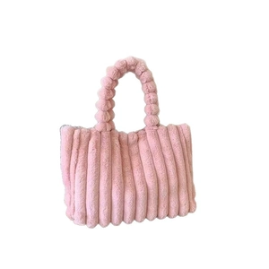 Pink plush tote bag with vertical pleated texture and soft faux fur handles in minimalist style