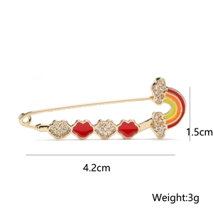 Detailed view of 18K gold brooch with rainbow cloud and zircon clover, 4.2cm in length