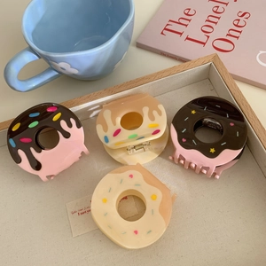 Cute doughnut shaped acetate hair claws in assorted colors for sweet hair styling