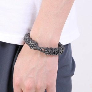 Punk eagle head men's steel bracelet with scale texture links on male model wrist
