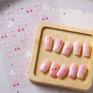 Pink bow and cherry 3D nail art set with gradient press-on nails in a wooden tray