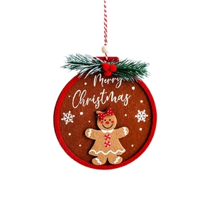 Felt gingerbread girl ornament in round frame with pine needles for Christmas tree decor