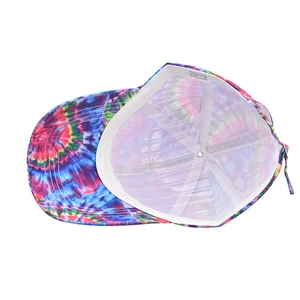 Detail of multi-color tie-dye baseball cap interior with 100% polyester material label