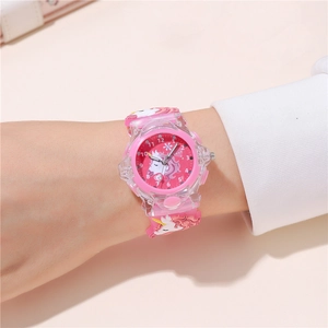 Detailed view of pink unicorn children watch with LED glowing silicone strap and dial