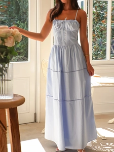 Detail of light blue tiered maxi dress with pleated bodice and thin spaghetti straps