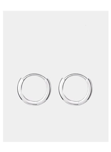 Close-up of polished silver hoop earrings with a minimalist round design on white background
