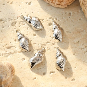 Textured 304 stainless steel conch pendants for jewelry making on stone background