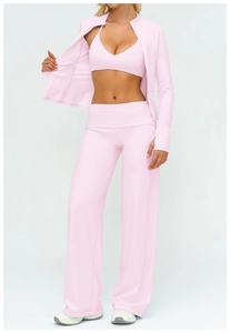 Detailed view of light pink three-piece yoga set including jacket, bra and wide-leg pants