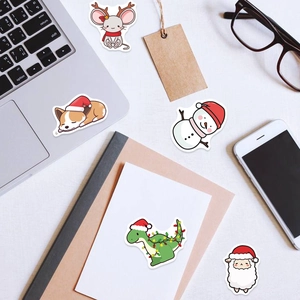 Detail of waterproof cartoon Christmas stickers on laptop and notebook