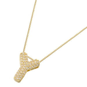 Macro shot of gold-plated letter Y pendant encrusted with cubic zirconia on a box chain