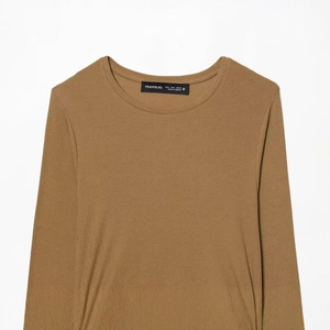 Minimalist long sleeve crewneck top in coffee brown knit fabric displayed in flat lay