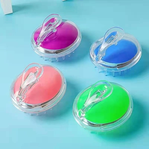 Four colorful silicone scalp massager brushes with transparent handles for hair washing